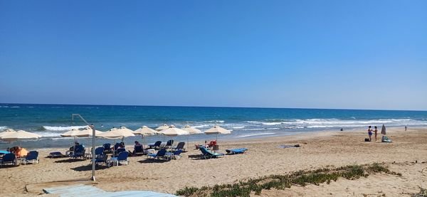 Analipsi Beach with palm trees near Gouves, Crete
